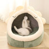 Create a charming space for your cat with this cute cat house, complete with an engaging toy.
